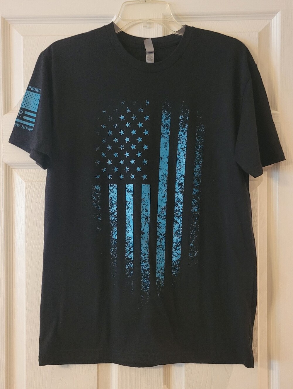 Next Level Apparel Black Tee with Distressed Blue Flag Graphic